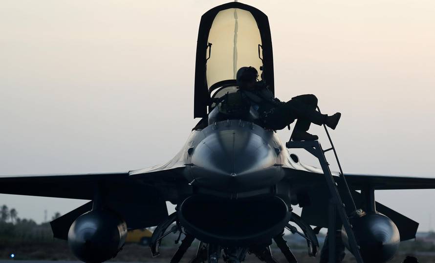 A Chilean pilot leaves the cockpit of his F-16 jet fighter during CRUZEX in Natal