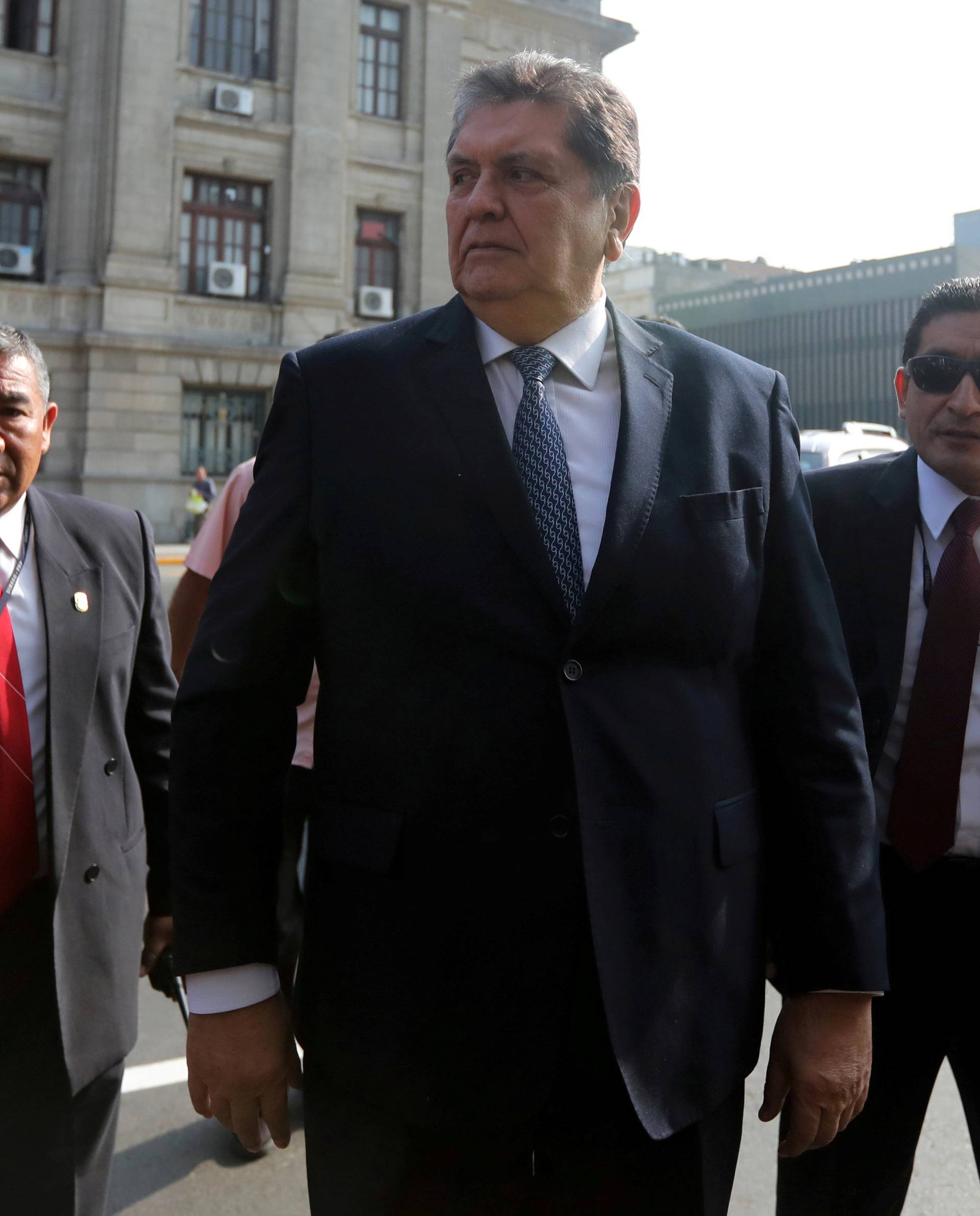 FILE PHOTO: Former Peruvian president Alan Garcia talks to the media as he arrives at the National Prosecution office in Lima