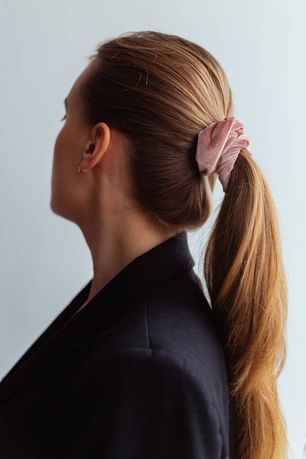 Close-up of a baby pink scrunchie.