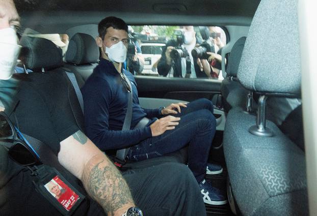 Serbian tennis player Novak Djokovic departs from the Park Hotel government detention facility before attending a court hearing at his lawyers office in Melbourne