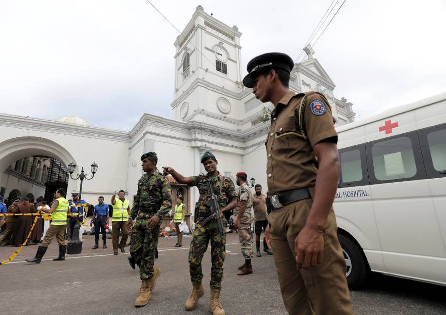 Sri Lankan military officials stand guard in front of the St. Anthony's Shrine, Kochchikade church after an explosion in Colombo