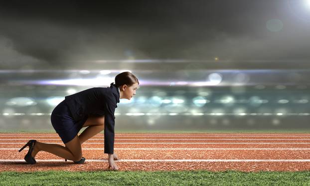 Side,View,Of,Businesswoman,At,Stadium,Standing,In,Start,Position