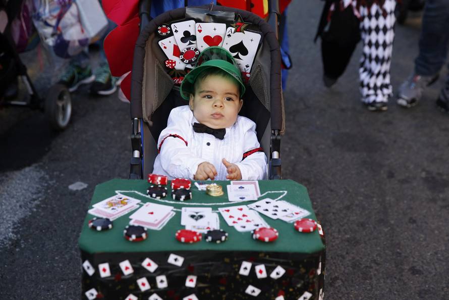A young child takes part in the Hoboken Ragamuffin Parade to celebrate Halloween in Hoboken, New Jersey 