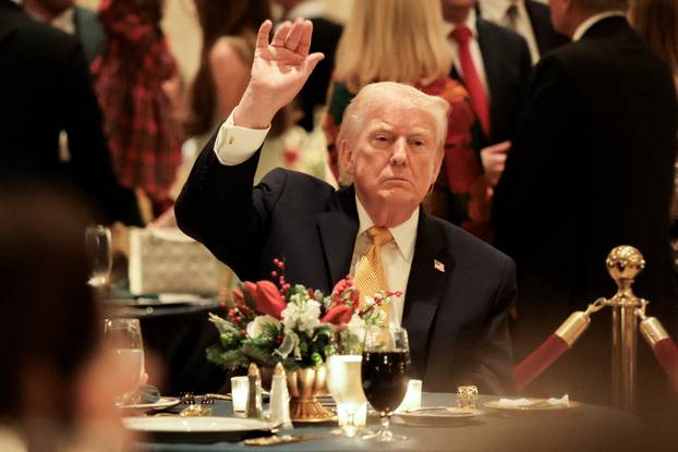U.S. President Trump takes part in a Christmas Eve dinner in the ballroom of his Mar-a-Lago club in Palm Beach