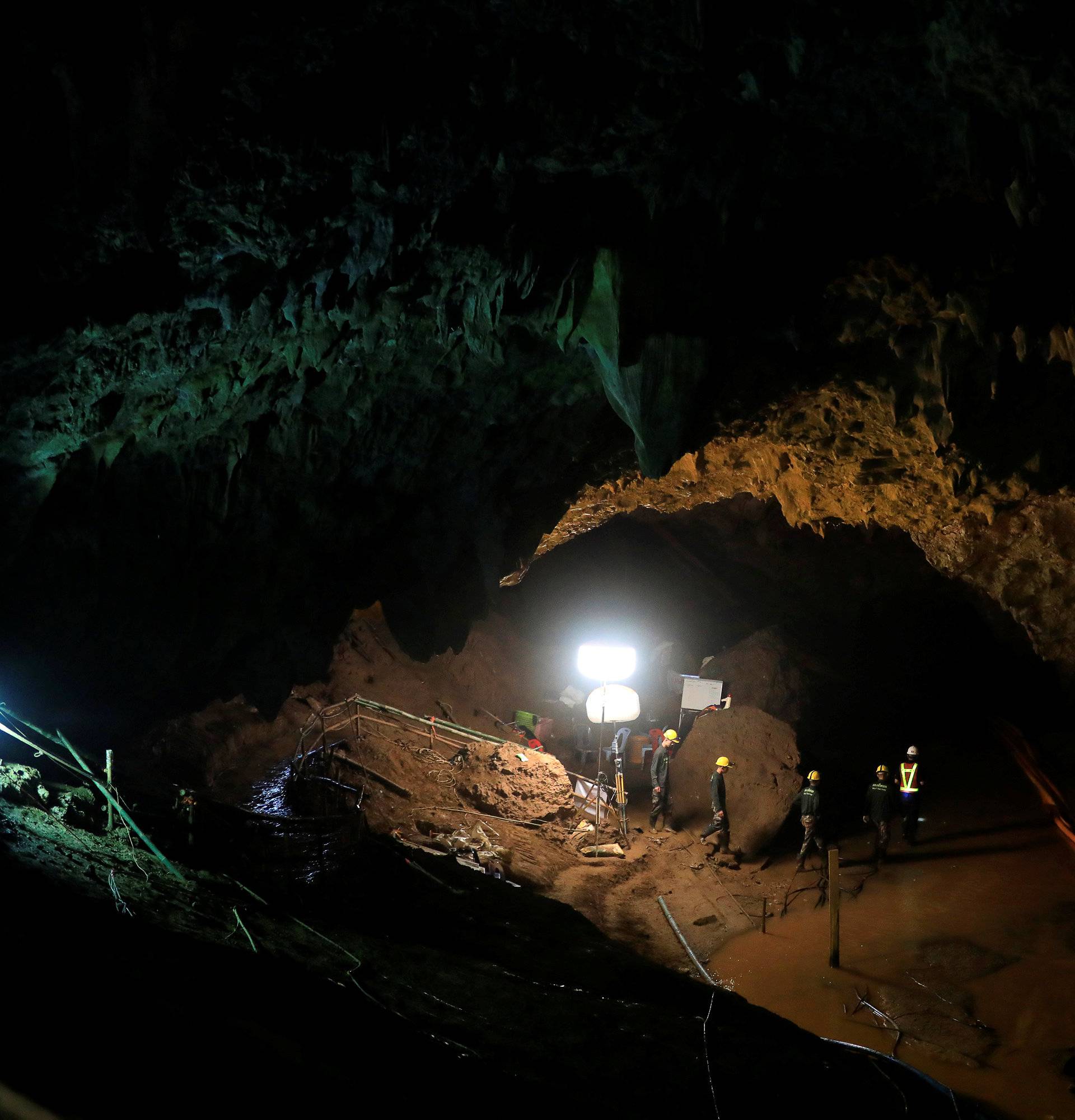 Soldiers walk after 12 soccer players and their coach were rescued near Tham Luang cave complex in the northern province of Chiang Rai