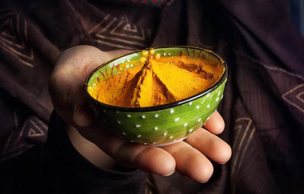 Woman in turban with yellow spice