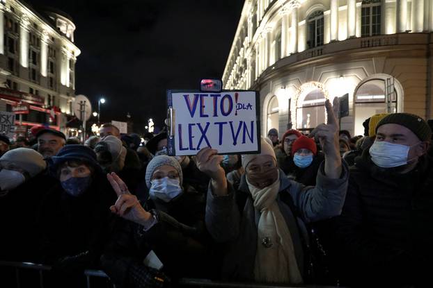 People protest against media law affecting U.S.-owned news channel in Warsaw