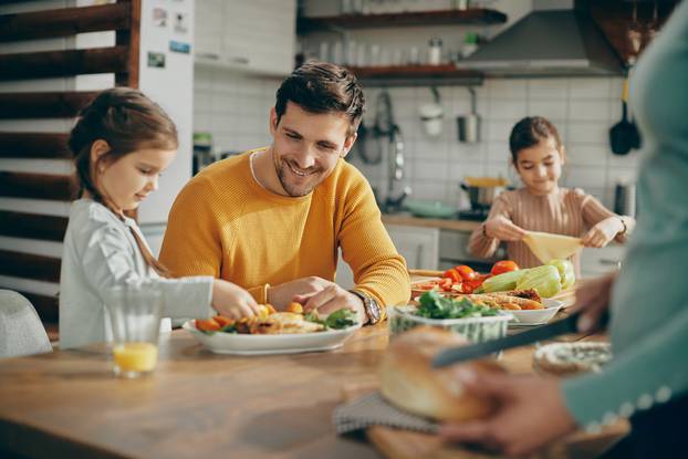 Happy,Family,Preparing,Dining,Table,For,Lunch,At,Home.,Focus