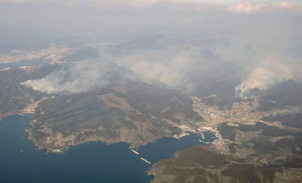 An aerial views shows a forest fire on a mountain in Ofunato, Iwate Prefecture, northeastern Japan