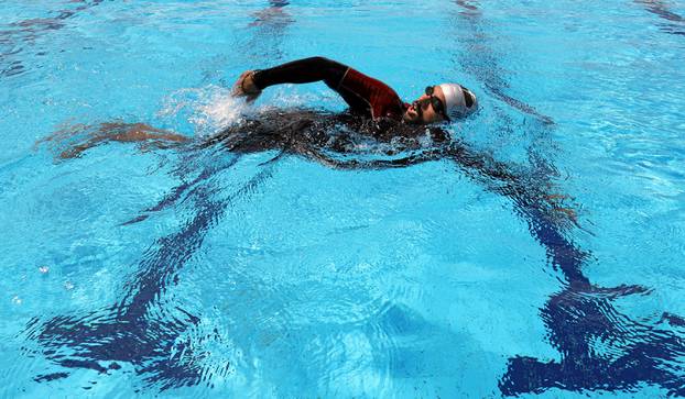 Egyptian swimmer Omar Hegazy, who is the first one-legged man to swim across the Gulf of Aqaba from Egypt to Jordan, during practice in Cairo