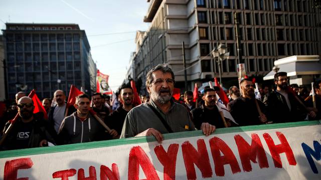 Members of the communist-affiliated PAME union shout slogans during a 48-hour general strike against tax and pension reforms in Athens