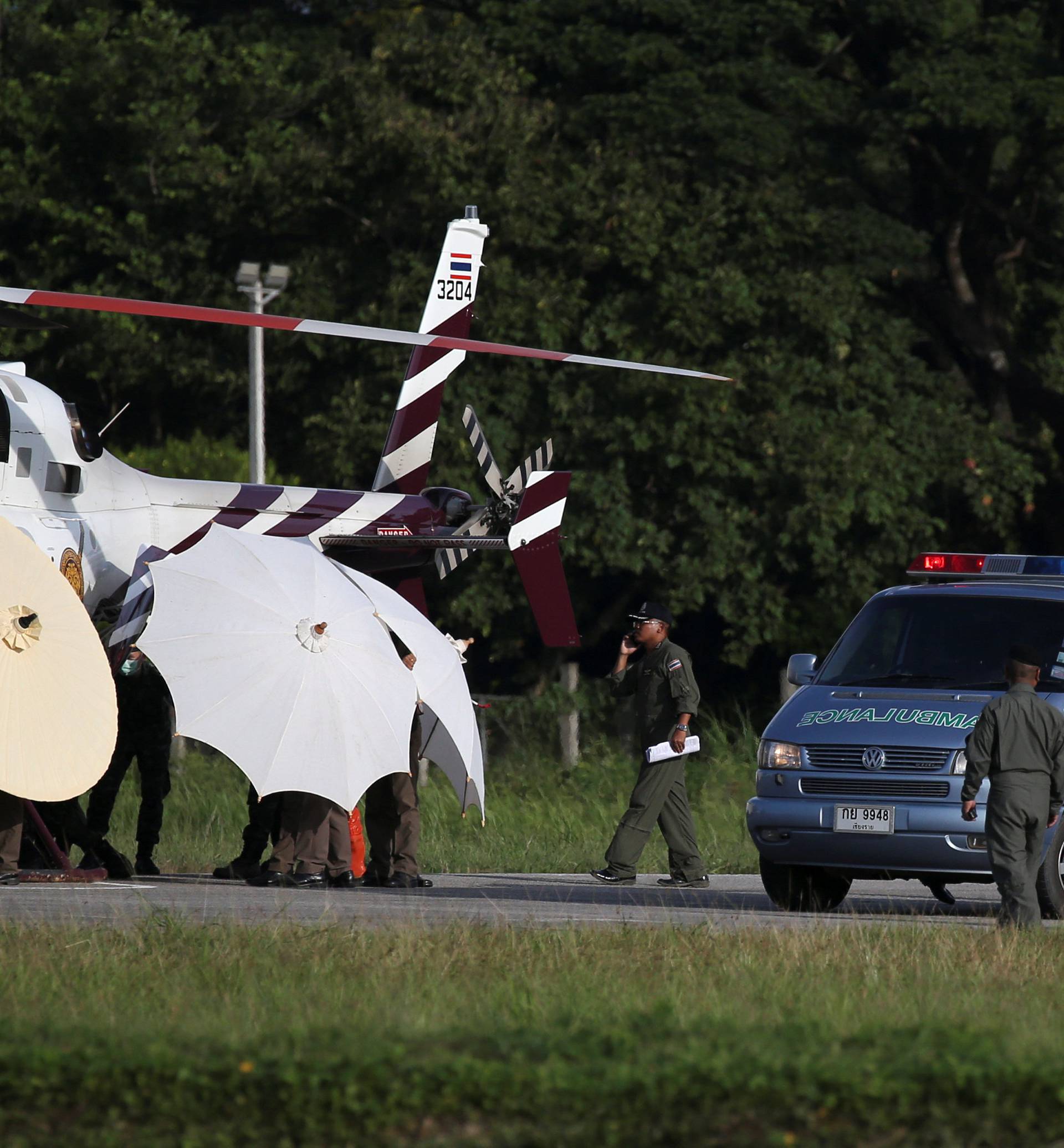 Rescued schoolboys are moved from a Royal Thai Police helicopter to an awaiting ambulance at a military airport in Chiang Rai