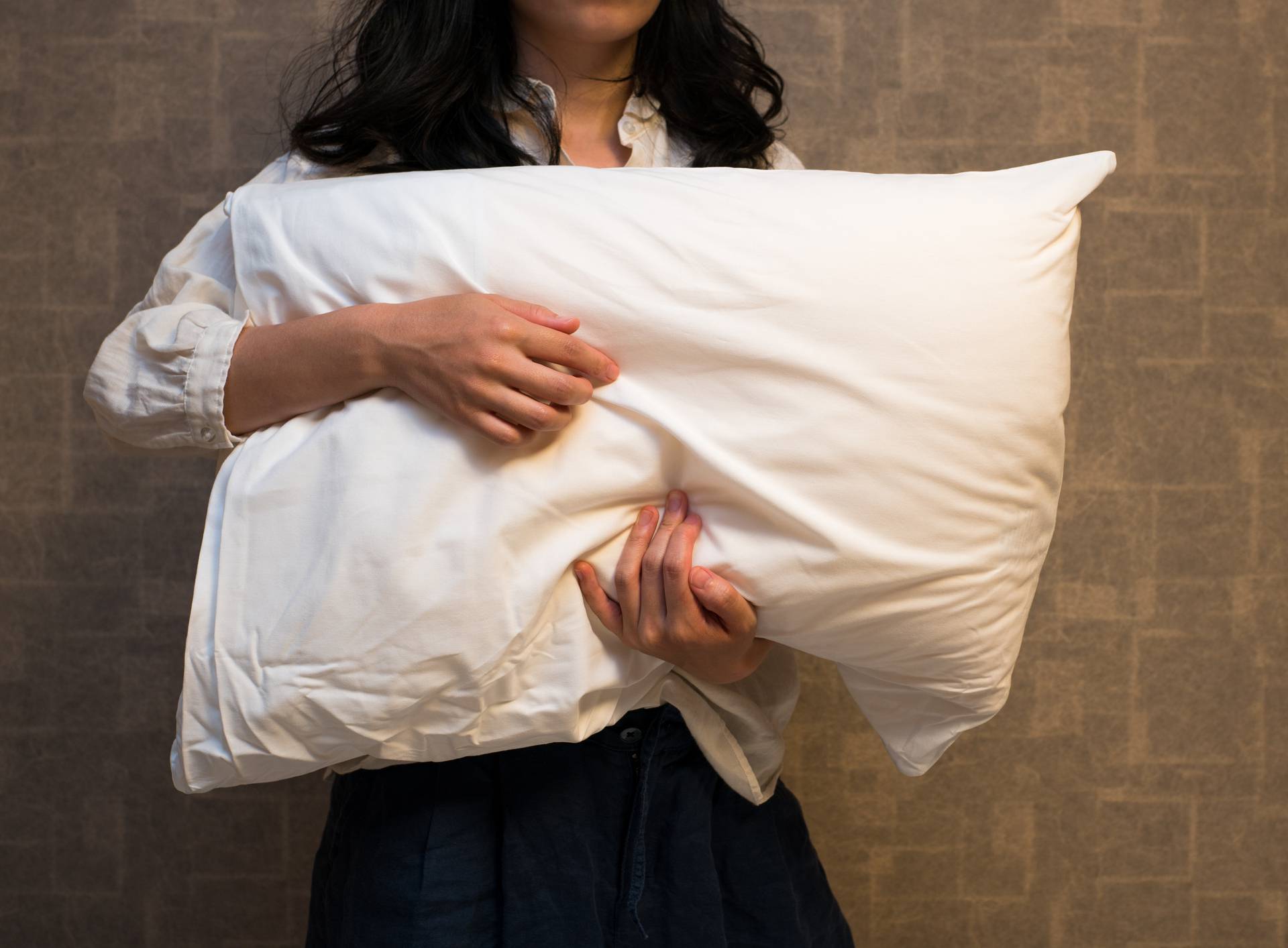 Woman holding a pillow