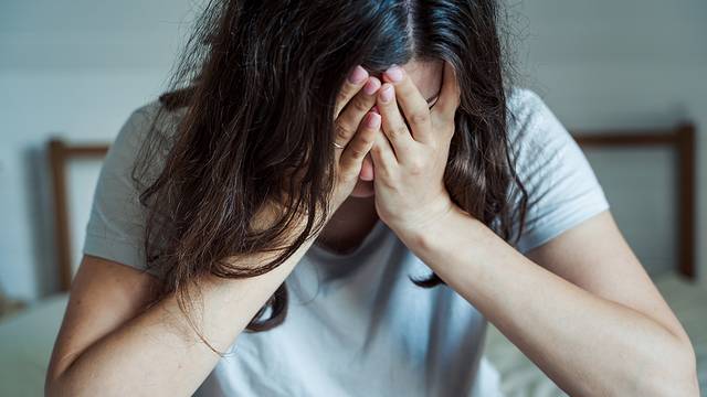 Sad, Unhappy Woman In Depression. Headache, Stress, Anxiety Tens