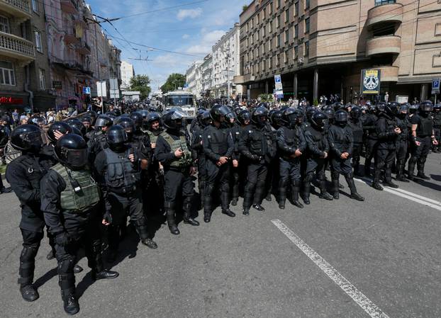 Policemen stand guard during Equality March in Kiev