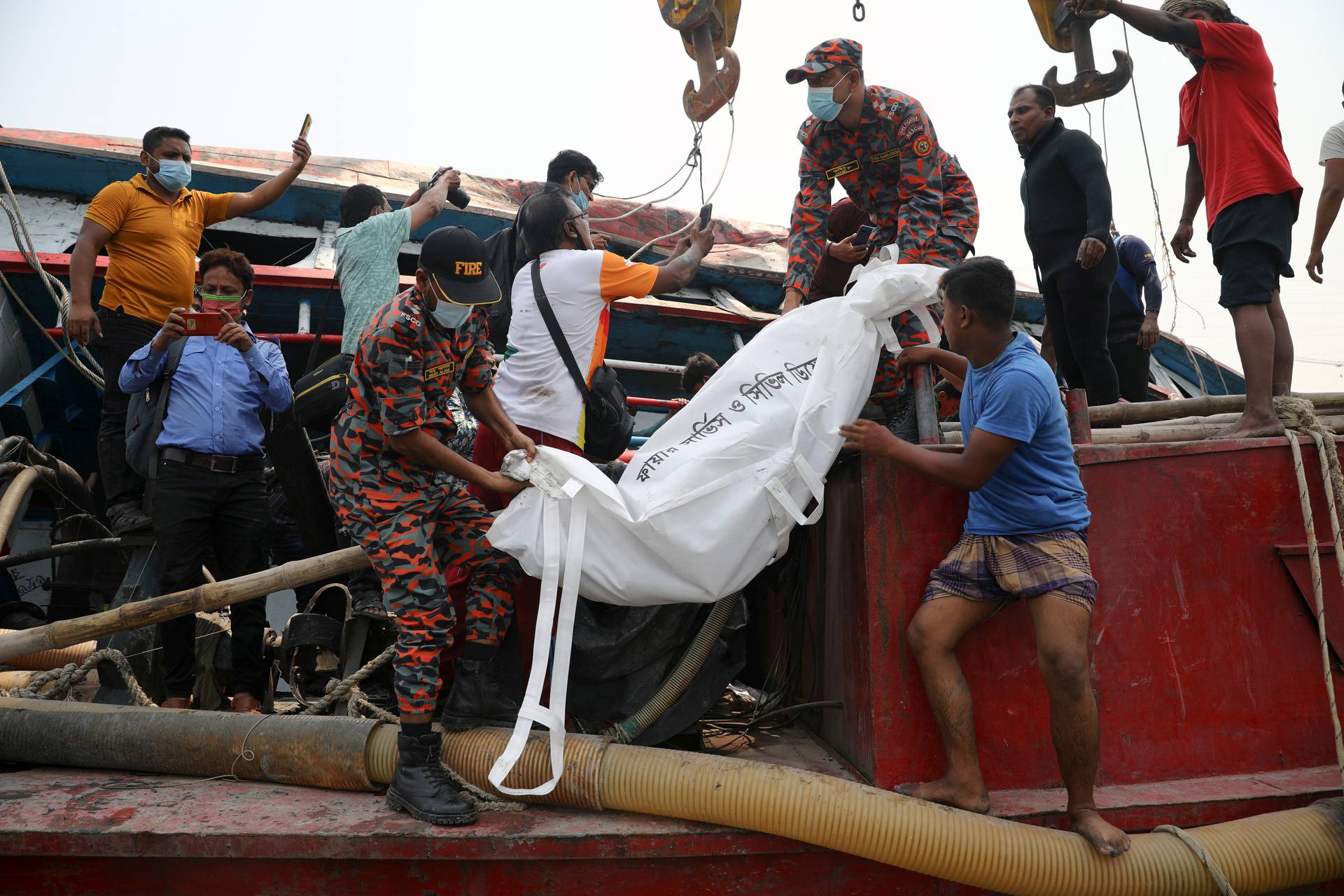 Rescue operations following collision and sinking of a ferry at the Shitalakhsyaa River in Narayanganj