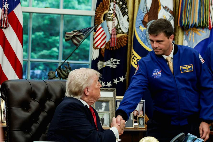 U.S. President Donald Trump meets Artemis II astronauts in the Oval Office at the White House in Washington