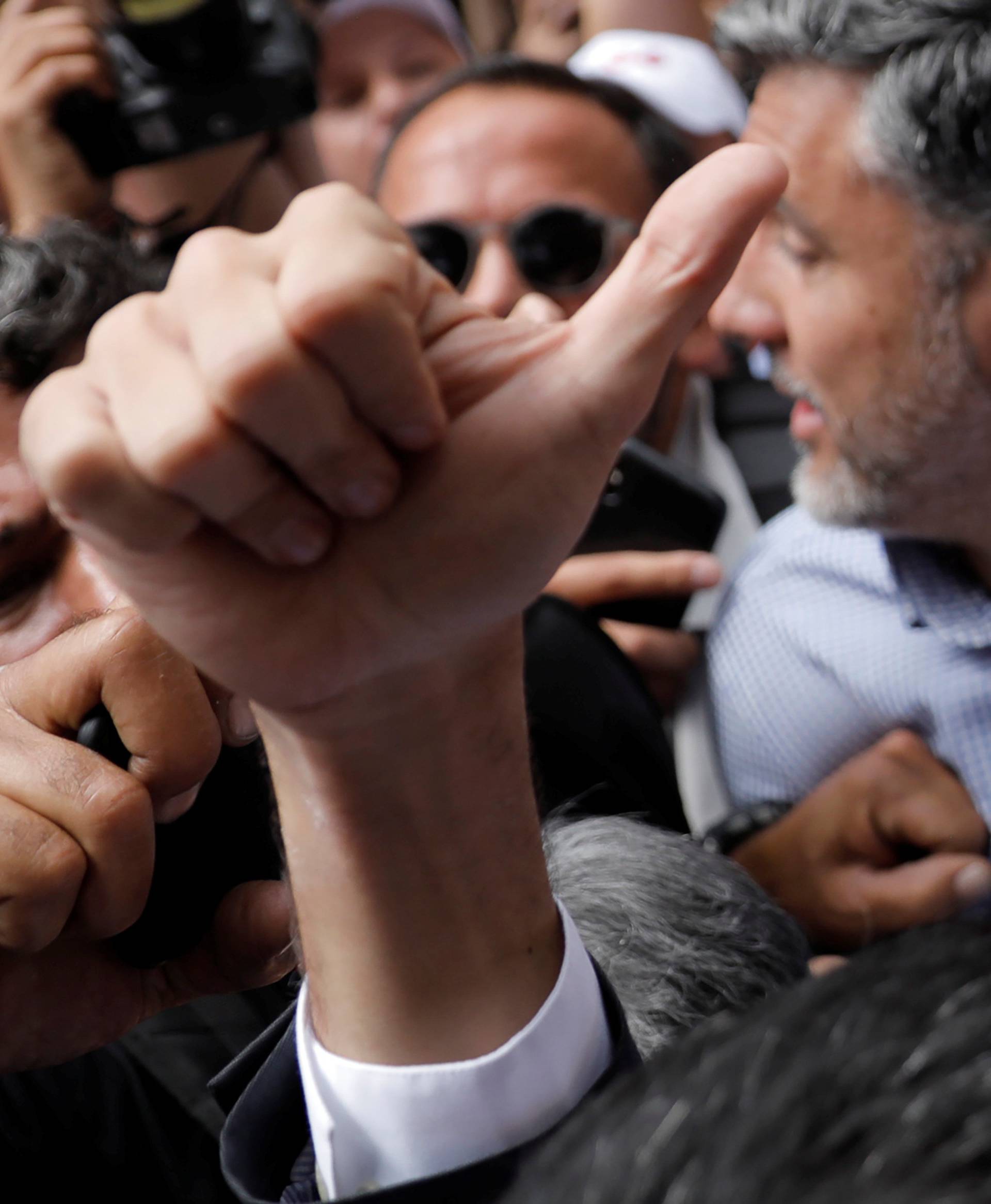 Venezuela's opposition leader Juan Guaido gestures as he arrives for a news conference in Caracas, Venezuela