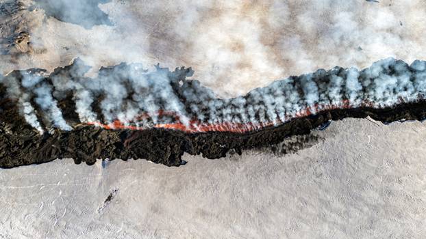 Italy's Mount Etna erupts