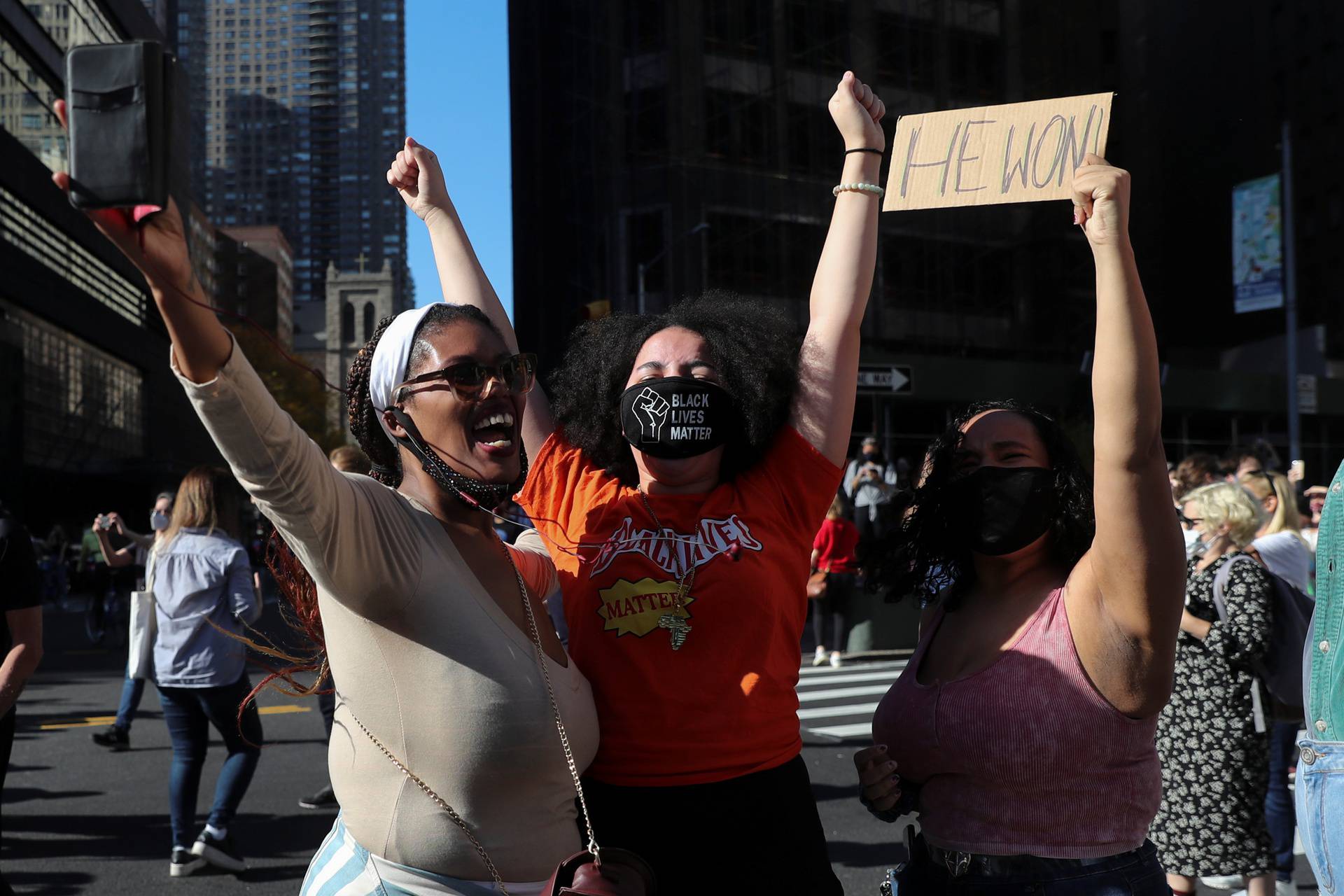 People celebrate media announcing that Democratic U.S. presidential nominee Joe Biden has won the 2020 U.S. presidential election