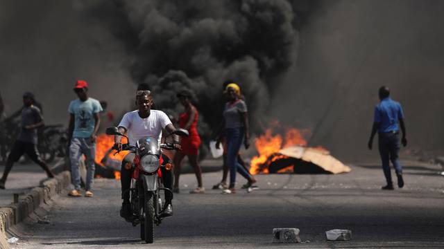 FILE PHOTO: People demonstrate against the government and insecurity in Port-au-Prince