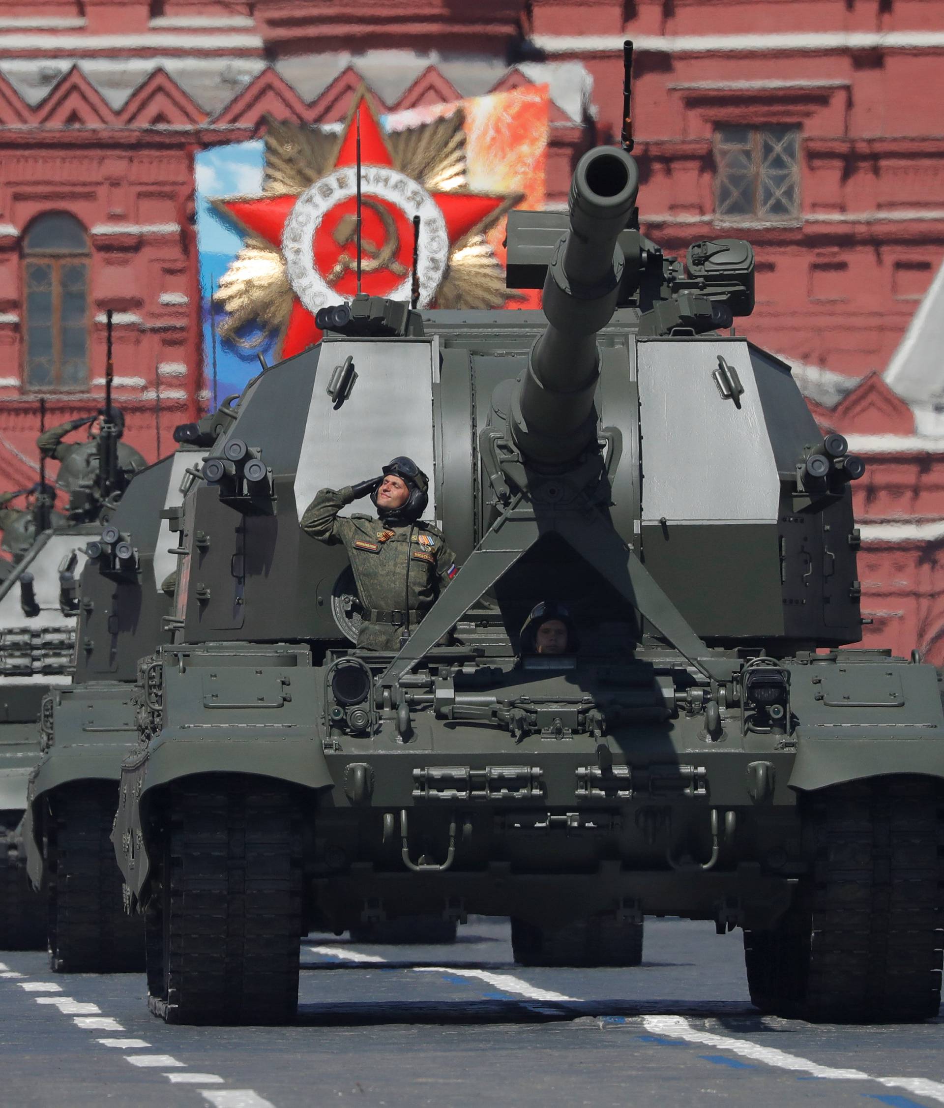 Russian servicemen drive Koalitsiya-SV self-propelled howitzers during the Victory Day parade at the Red Square in Moscow