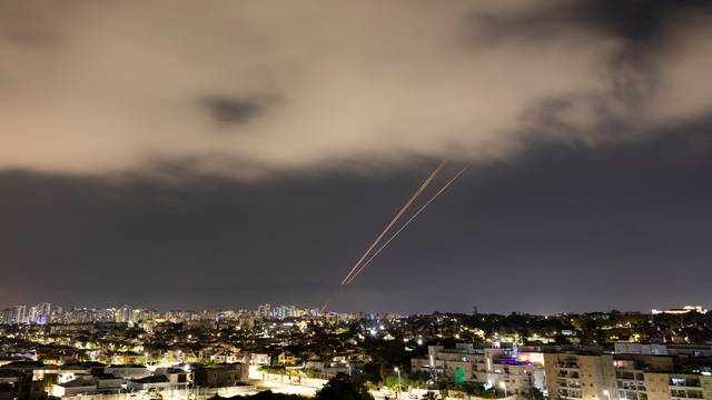 Objects are intercepted in the sky after Iran launched drones and missiles towards Israel, as seen from Ashkelon