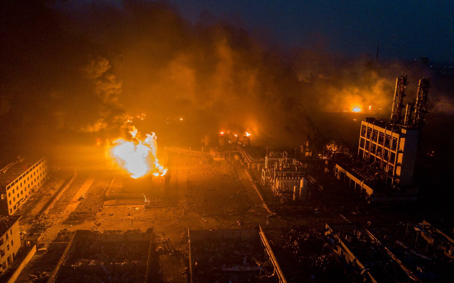 Smoke billows from fire following an explosion at the pesticide plant owned by Tianjiayi Chemical, in Xiangshui