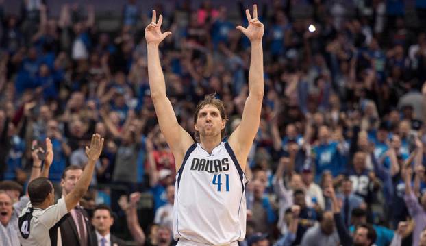 File Photo: Dallas Mavericks forward Dirk Nowitzki (41) celebrates after making a three point shot against the Portland Trail Blazers during the second half  in Dallas