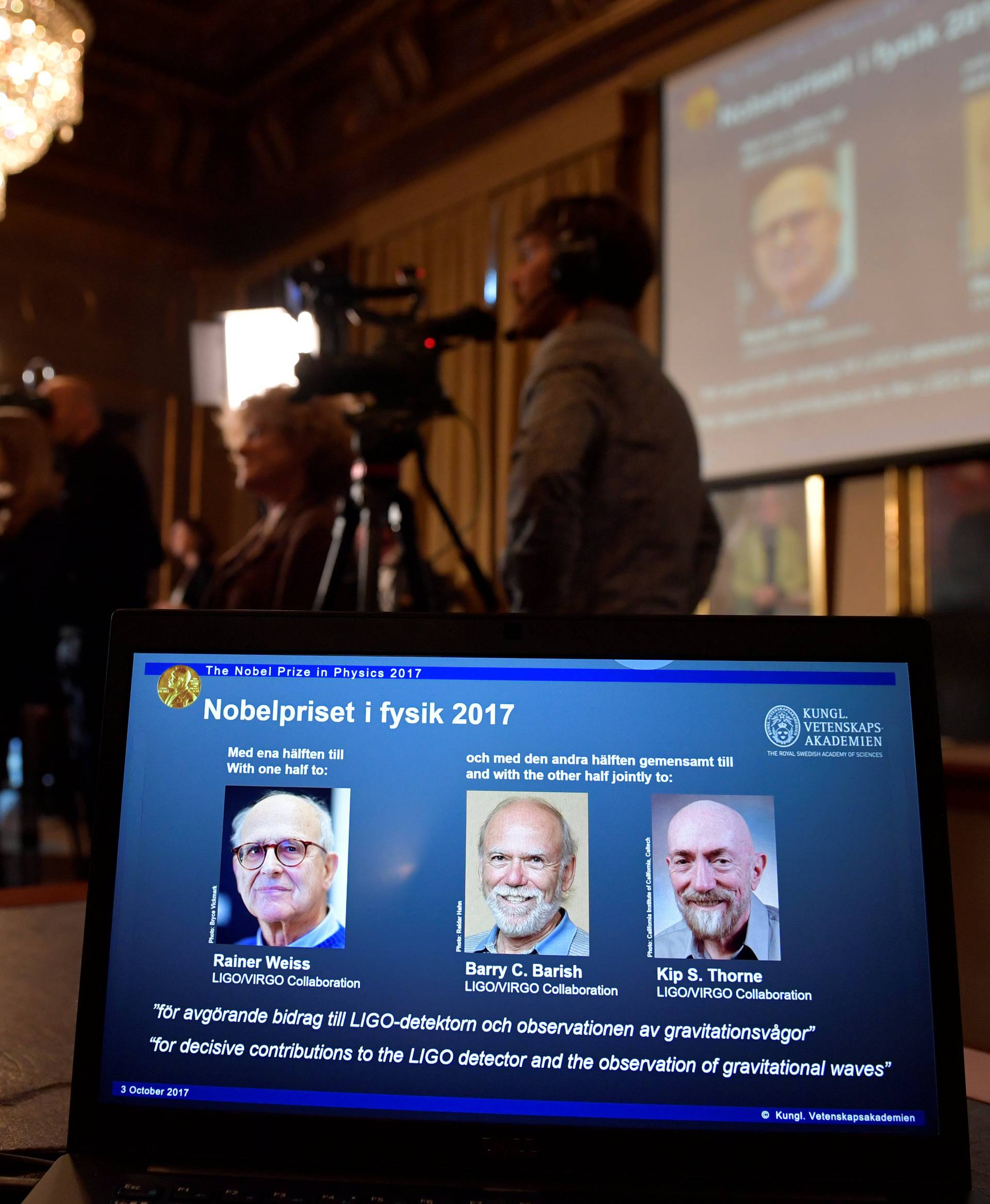 The names of Rainer Weiss, Barry C. Barish, Kip S. Thorne are displayed on the screen during the announcement of the winners of the Nobel Prize in Physics 2017, in Stockholm