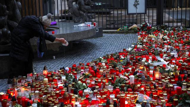 People observe national mourning day to honour the victims of the Prague shooting