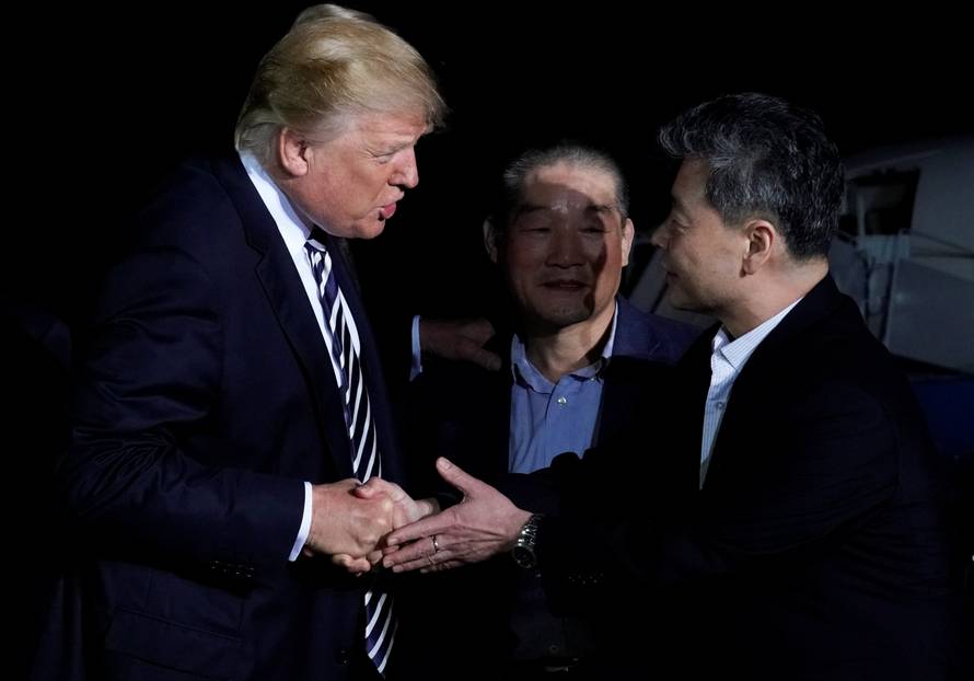 U.S.President Donald Trump greets the Americans released from detention in North Korea upon their arrival at Joint Base Andrews