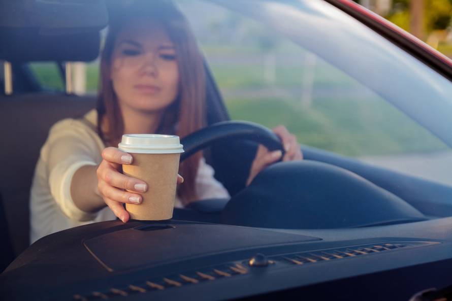 The girl behind the wheel of a car