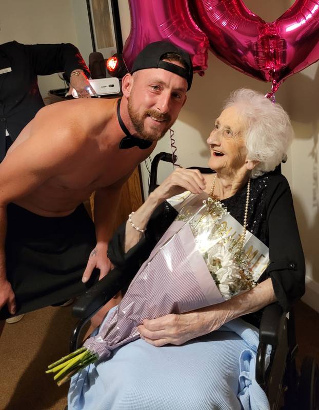 Tea and beef-cake! OAP gets Butler in the Buff for her 103rd birthday at care home