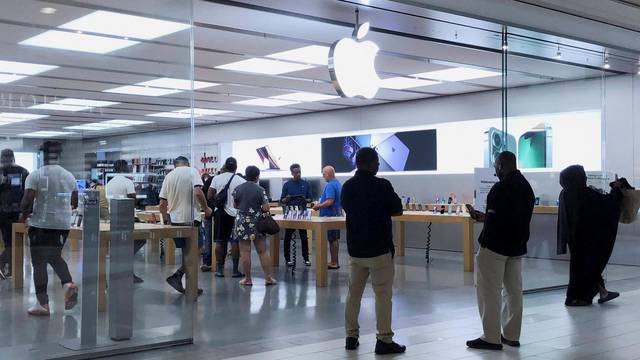 People visit the Apple store at the Cumberland Mall in Atlanta