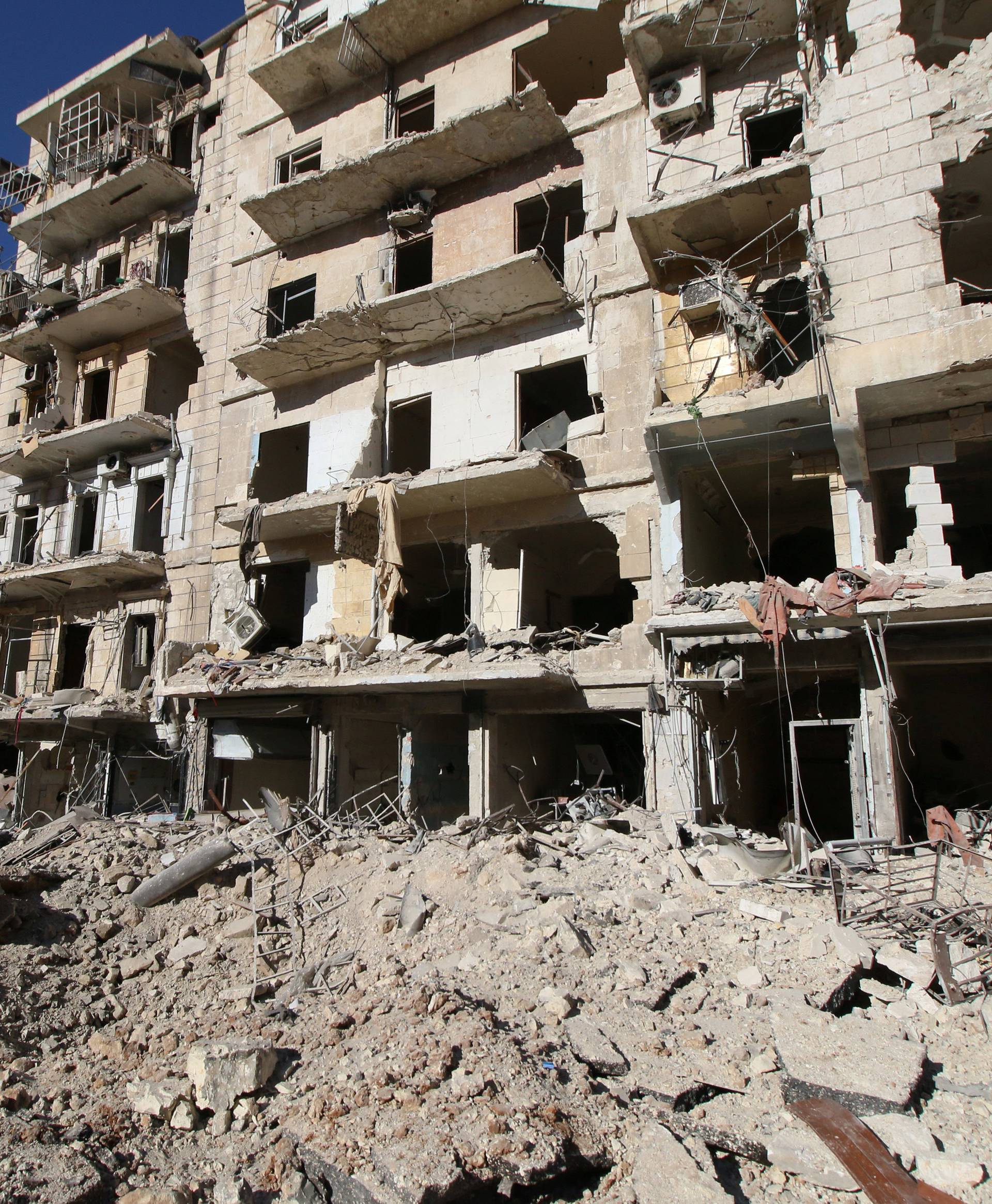 A general view shows the damage at a site hit by airstrikes in the rebel-held besieged al-Qaterji neighbourhood of Aleppo