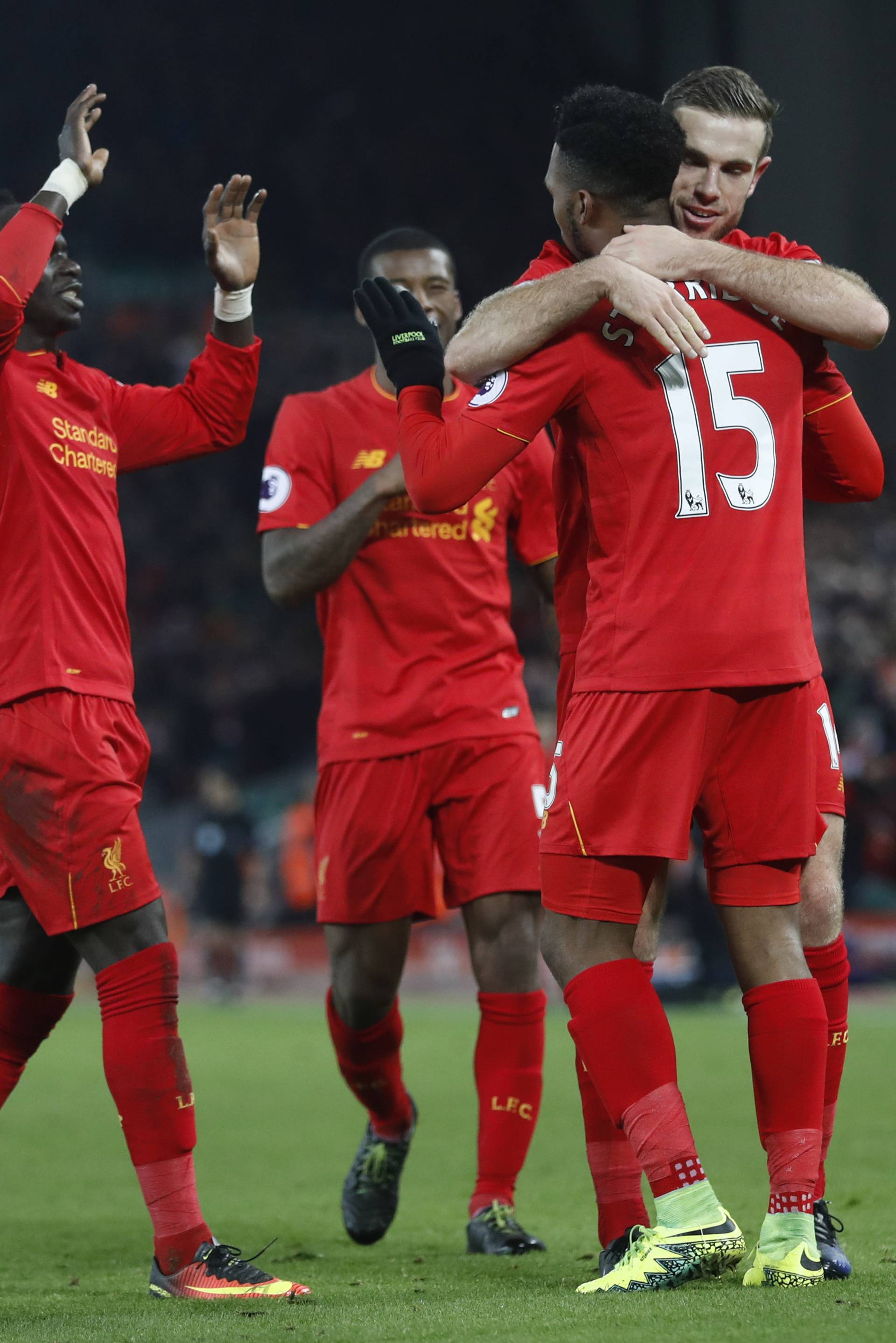 Liverpool's Daniel Sturridge celebrates scoring their fourth goal with team mates