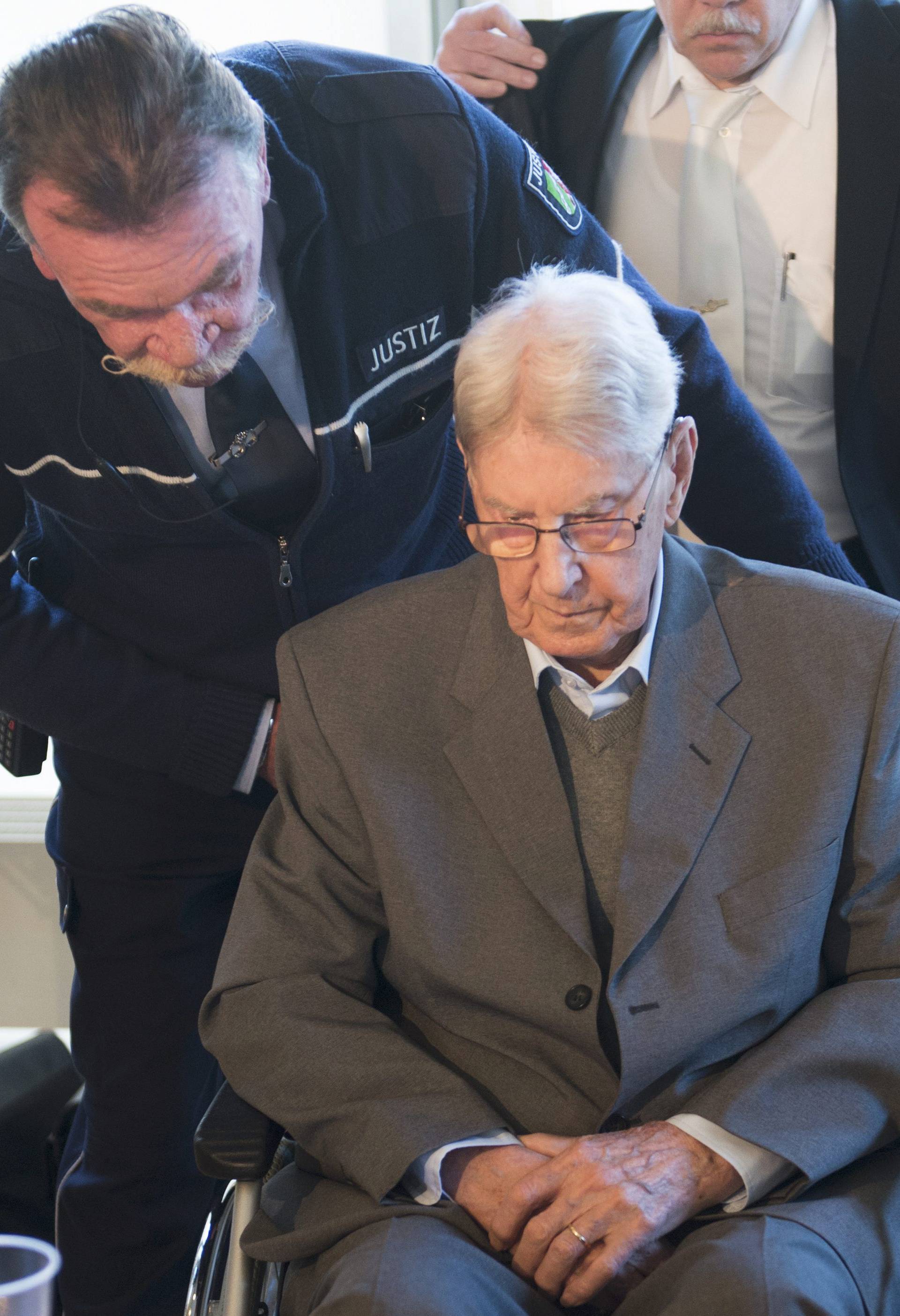 Defendant Hanning, a 94-year-old former guard at Auschwitz death camp, arrives for the continuation of his trial in Detmold
