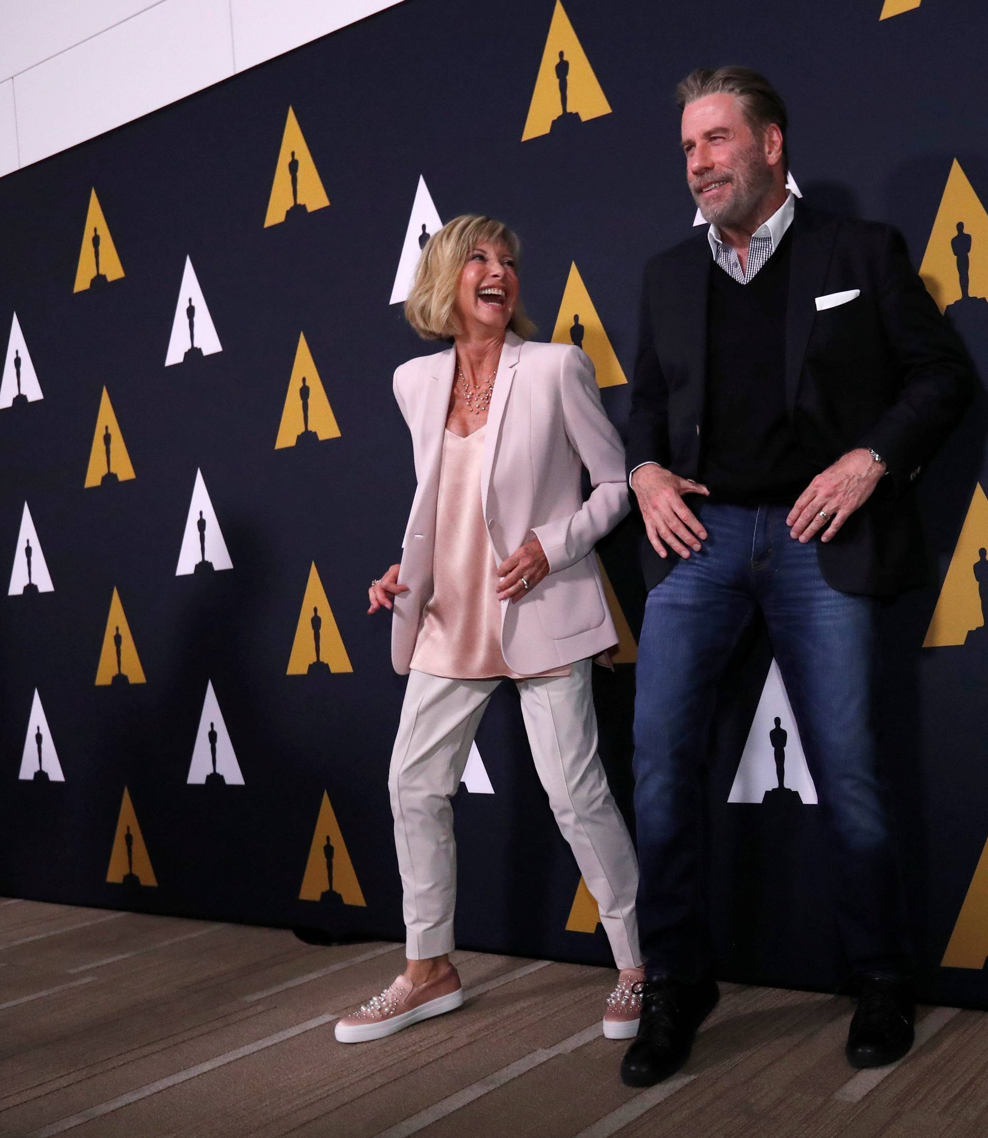 Cast members Travolta and Newton-John dance at a 40th anniversary screening of "Grease" at the Academy of Motion Picture Arts and Sciences in Beverly Hills