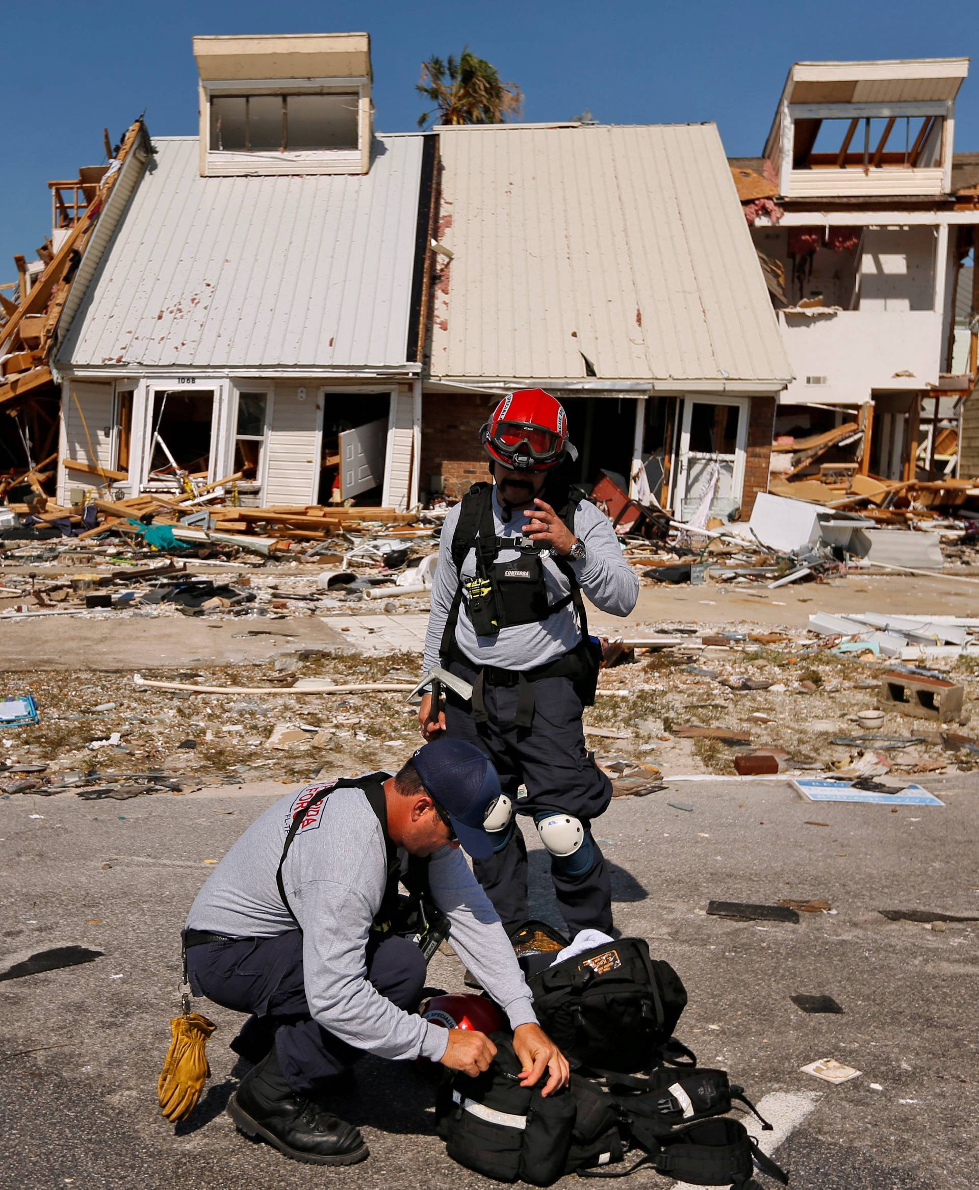 FILE PHOTO: Members of search and rescue crew are seen next to property damaged by Hurricane Michael in Mexico Beach