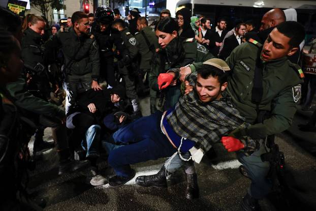 Israelis protest a ceasefire deal, in Jerusalem