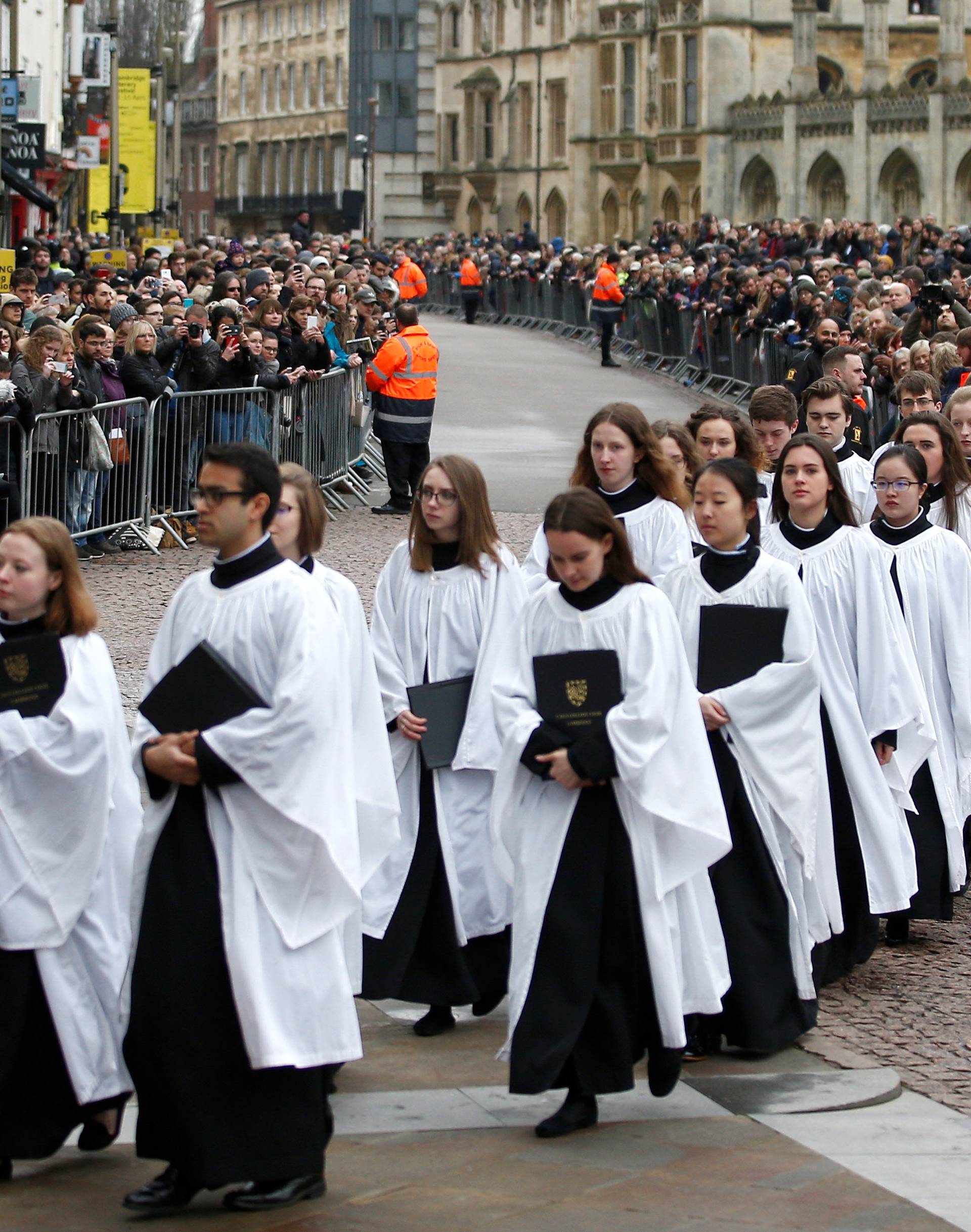 Members of the church choir arrive at Great St Marys Church, where the funeral of theoretical physicist Prof Stephen Hawking is being held, in Cambridge