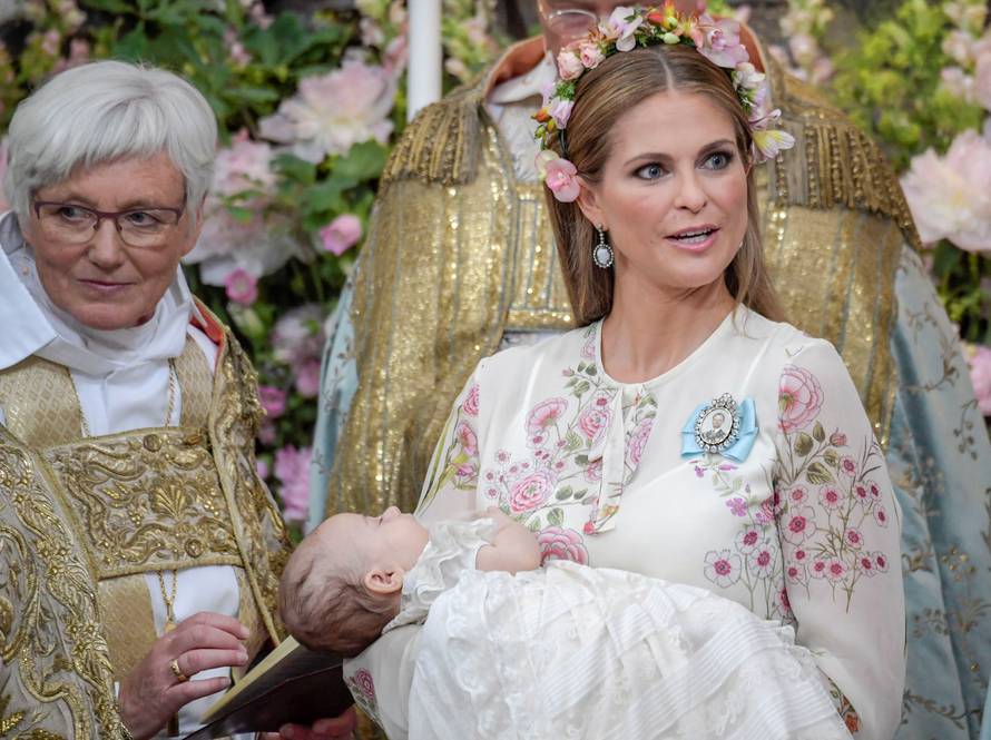 Princess Madeleine and officiant Archbishop Antje Jackelen are seen during  princess Adrienne's christening ceremony in Drottningholm Palace Chapel, Stockholm