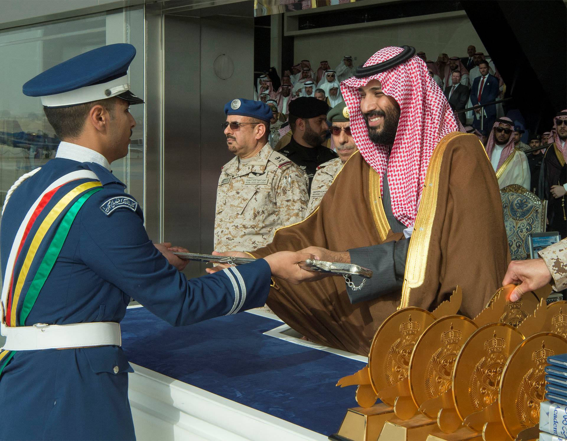 Cadet of King Faisal Air Academy receives a sword from Saudi Arabia's Crown Prince Mohammed bin Salman during a graduation ceremony in Riyadh