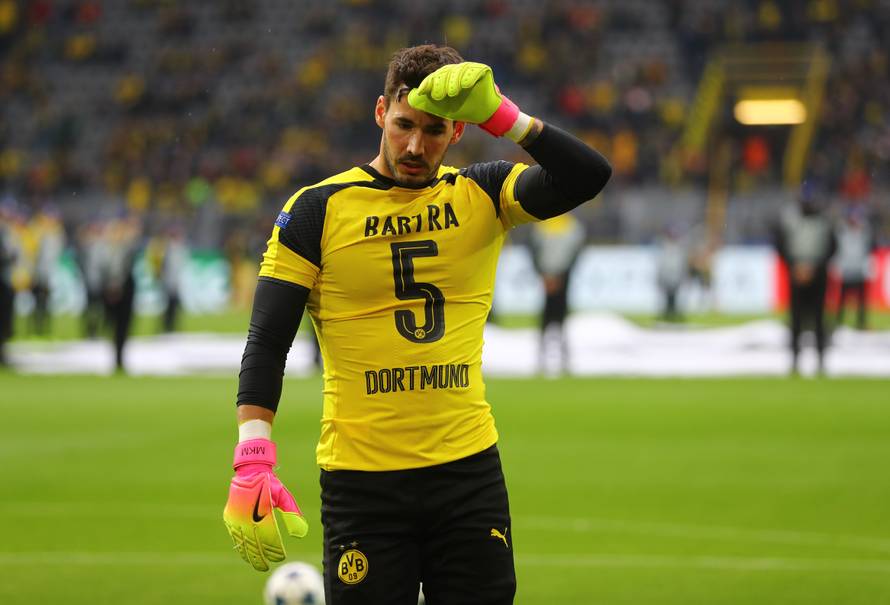 Borussia Dortmund's Roman Burki wears the shirt of Marc Bartra before the match