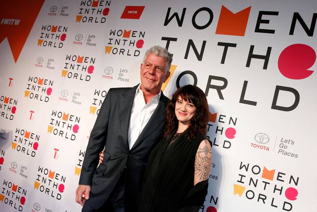 FILE PHOTO: Anthony Bourdain poses with Italian actor and director Asia Argento for the Women In The World Summit in New York