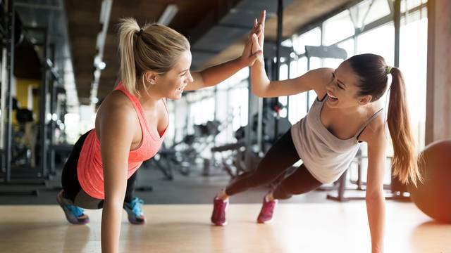 Beautiful,Women,Working,Out,In,Gym,Together