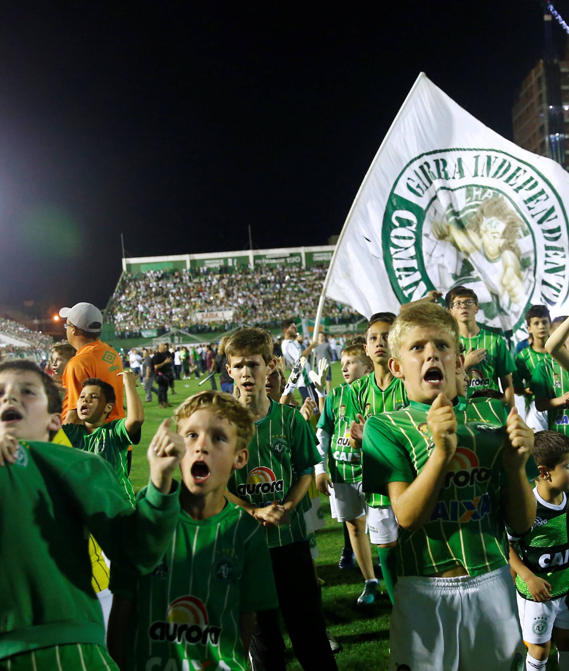 Youth players of Chapecoense soccer club pay tribute to Chapecoense's players at the Arena Conda stadium in Chapeco