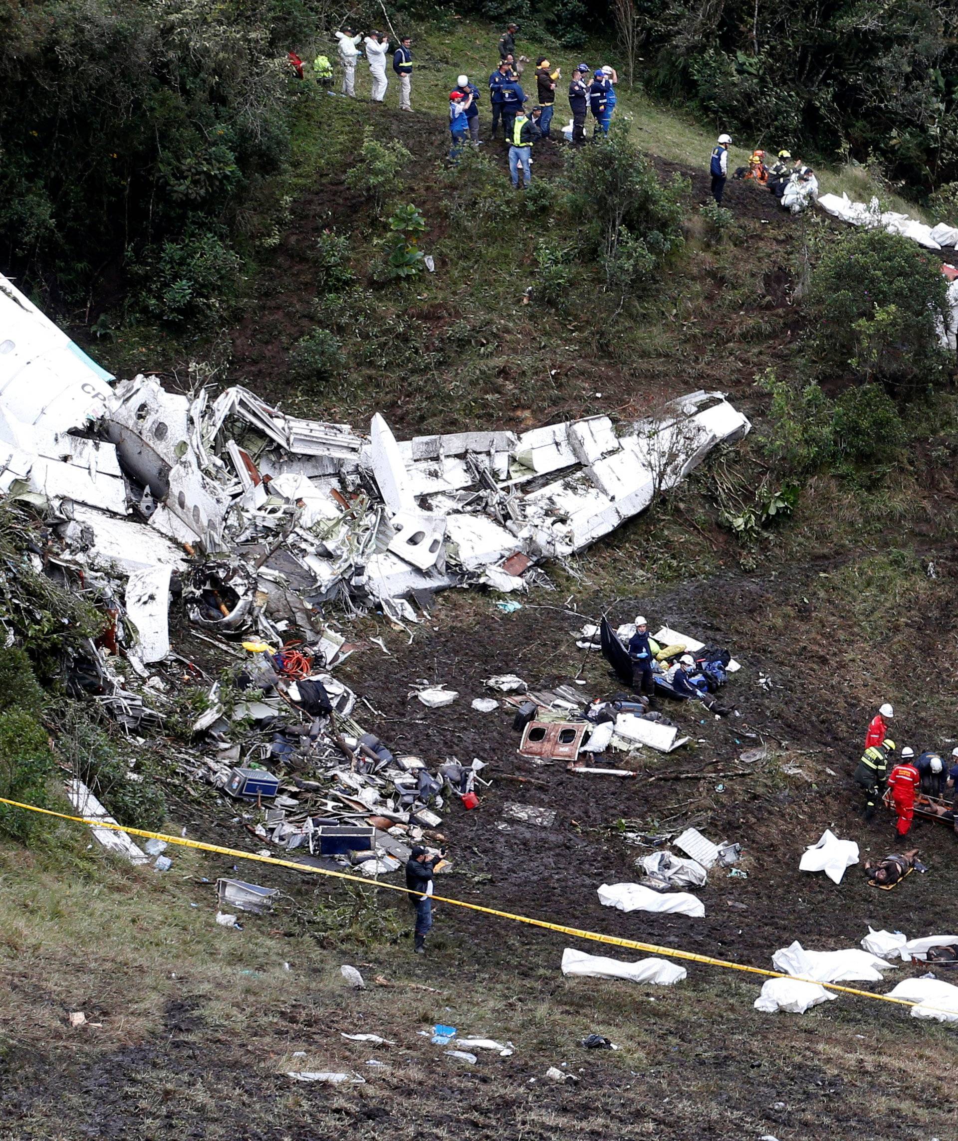 Rescue crew work at the wreckage of a plane that crashed into the Colombian jungle with Brazilian soccer team Chapecoense near Medellin
