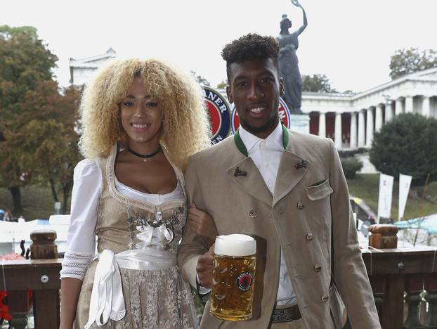 Coman of FC Bayern Munich and Sephora pose during their visit at the Oktoberfest in Munich